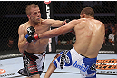 CALGARY, CANADA - JULY 21:  (L-R) Nick Ring lands a punch to the head of Court McGee during their middleweight bout at UFC 149 inside the Scotiabank Saddledome on July 21, 2012 in Calgary, Alberta, Canada.  (Photo by Nick Laham/Zuffa LLC/Zuffa LLC via Getty Images)