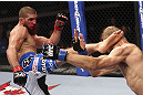 CALGARY, CANADA - JULY 21:  Court McGee lands a kick to the head of Nick Ring during their middleweight bout at UFC 149 inside the Scotiabank Saddledome on July 21, 2012 in Calgary, Alberta, Canada.  (Photo by Nick Laham/Zuffa LLC/Zuffa LLC via Getty Images)