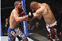 CALGARY, CANADA - JULY 21:  Court McGee throws a punch at Nick Ring during their middleweight bout at UFC 149 inside the Scotiabank Saddledome on July 21, 2012 in Calgary, Alberta, Canada.  (Photo by Nick Laham/Zuffa LLC/Zuffa LLC via Getty Images)