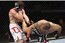 CALGARY, CANADA - JULY 21: (R-L) Chris Clements lands a kick to the ribs of Matthew Riddle during their welterweight bout at UFC 149 inside the Scotiabank Saddledome on July 21, 2012 in Calgary, Alberta, Canada.  (Photo by Nick Laham/Zuffa LLC/Zuffa LLC via Getty Images)