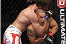 CALGARY, CANADA - JULY 21: (R-L) Chris Clements is caught in a choke hold from Matthew Riddle during their welterweight bout at UFC 149 inside the Scotiabank Saddledome on July 21, 2012 in Calgary, Alberta, Canada.  (Photo by Nick Laham/Zuffa LLC/Zuffa LLC via Getty Images)