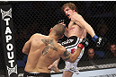CALGARY, CANADA - JULY 21:  (L-R) Chris Clements takes a kick from Matthew Riddle during their welterweight bout at UFC 149 inside the Scotiabank Saddledome on July 21, 2012 in Calgary, Alberta, Canada.  (Photo by Nick Laham/Zuffa LLC/Zuffa LLC via Getty Images)