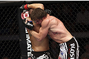 CALGARY, CANADA - JULY 21: (L-R) Chris Clements is caught by Matthew Riddle during their welterweight bout at UFC 149 inside the Scotiabank Saddledome on July 21, 2012 in Calgary, Alberta, Canada.  (Photo by Nick Laham/Zuffa LLC/Zuffa LLC via Getty Images)