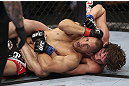 CALGARY, CANADA - JULY 21:  Chris Clements is caught on his back by Matthew Riddle during their welterweight bout at UFC 149 inside the Scotiabank Saddledome on July 21, 2012 in Calgary, Alberta, Canada.  (Photo by Nick Laham/Zuffa LLC/Zuffa LLC via Getty Images)