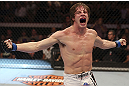 CALGARY, CANADA- JULY 21: Matthew Riddle celebrates after defeating Chris Clements during their welterweight bout at UFC 149 inside the Scotiabank Saddledome on July 21, 2012 in Calgary, Alberta, Canada.  (Photo by Nick Laham/Zuffa LLC/Zuffa LLC via Getty Images)
