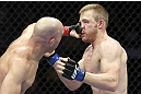 CALGARY, CANADA - JULY 21: (L-R) Brian Ebersole lands a punch on the face of James Head during their welterweight bout at UFC 149 inside the Scotiabank Saddledome on July 21, 2012 in Calgary, Alberta, Canada.  (Photo by Nick Laham/Zuffa LLC/Zuffa LLC via Getty Images)