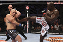 CALGARY, CANADA - JULY 21: (R-L) Cheick Kongo lands a kick to the body of Shawn Jordan during their heavyweight bout at UFC 149 inside the Scotiabank Saddledome on July 21, 2012 in Calgary, Alberta, Canada.  (Photo by Nick Laham/Zuffa LLC/Zuffa LLC via Getty Images)