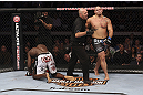 CALGARY, CANADA - JULY 21: (L-R) Cheick Kongo kneels after Shawn Jordan hit him with an accidental elbow below the belt during their heavyweight bout at UFC 149 inside the Scotiabank Saddledome on July 21, 2012 in Calgary, Alberta, Canada.  (Photo by Nick Laham/Zuffa LLC/Zuffa LLC via Getty Images)