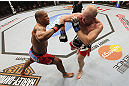 CALGARY, CANADA - JULY 21:  (L-R) Hector Lombard exchanges punches with Tim Boetsch during their middleweight bout at UFC 149 inside the Scotiabank Saddledome on July 21, 2012 in Calgary, Alberta, Canada.  (Photo by Nick Laham/Zuffa LLC/Zuffa LLC via Getty Images)