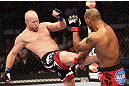 CALGARY, CANADA - JULY 21: (L-R) Tim Boetsch lands a kick to the body of Hector Lombard during their middleweight bout at UFC 149 inside the Scotiabank Saddledome on July 21, 2012 in Calgary, Alberta, Canada.  (Photo by Nick Laham/Zuffa LLC/Zuffa LLC via Getty Images)