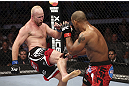 CALGARY, CANADA - JULY 21: (L-R) Tim Boetsch kicks Hector Lombard during their middleweight bout at UFC 149 inside the Scotiabank Saddledome on July 21, 2012 in Calgary, Alberta, Canada.  (Photo by Nick Laham/Zuffa LLC/Zuffa LLC via Getty Images)