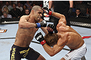 CALGARY, CANADA - JULY 21: (L-R) Renan Barao throws a punch at Urijah Faber during their UFC interim bantamweight championship bout at UFC 149 inside the Scotiabank Saddledome on July 21, 2012 in Calgary, Alberta, Canada.  (Photo by Nick Laham/Zuffa LLC/Zuffa LLC via Getty Images)