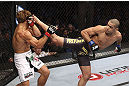 CALGARY, CANADA - JULY 21: (L-R) Urijah Faber blocks a kick from Renan Barao during their UFC interim bantamweight championship bout at UFC 149 inside the Scotiabank Saddledome on July 21, 2012 in Calgary, Alberta, Canada.  (Photo by Nick Laham/Zuffa LLC/Zuffa LLC via Getty Images)