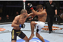 CALGARY, CANADA - JULY 21: (L-R) Renan Barao lands a punch to Urijah Faber during their UFC interim bantamweight championship bout at UFC 149 inside the Scotiabank Saddledome on July 21, 2012 in Calgary, Alberta, Canada.  (Photo by Nick Laham/Zuffa LLC/Zuffa LLC via Getty Images)
