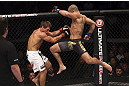 CALGARY, CANADA - JULY 21: (R-L) Renan Barao leaps toward Urijah Faber during their UFC interim bantamweight championship bout at UFC 149 inside the Scotiabank Saddledome on July 21, 2012 in Calgary, Alberta, Canada.  (Photo by Nick Laham/Zuffa LLC/Zuffa LLC via Getty Images)