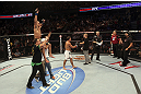 CALGARY, CANADA - JULY 21:  Renan Barao celebrates his victory over Urijah Faber during their UFC interim bantamweight championship bout at UFC 149 inside the Scotiabank Saddledome on July 21, 2012 in Calgary, Alberta, Canada.  (Photo by Nick Laham/Zuffa LLC/Zuffa LLC via Getty Images)