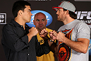 LOS ANGELES - AUGUST 02: (L-R) Opponents Lyoto Machida and Ryan Bader face off during the UFC on FOX press conference at the J.W. Marriott on August 2, 2012 in Los Angeles, California. (Photo by Josh Hedges/Zuffa LLC/Zuffa LLC via Getty Images)