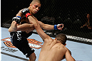 LOS ANGELES, CA - AUGUST 04:  John Moraga (L) kicks Ulysses Gomez in the first round during the UFC on FOX event at Staples Center on August 4, 2012 in Los Angeles, California.  (Photo by Josh Hedges/Zuffa LLC via Getty Images)