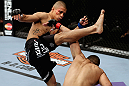 LOS ANGELES, CA - AUGUST 04:  John Moraga (L) kicks Ulysses Gomez in the first round during the UFC on FOX event at Staples Center on August 4, 2012 in Los Angeles, California.  (Photo by Josh Hedges/Zuffa LLC via Getty Images)