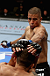 LOS ANGELES, CA - AUGUST 04:  John Moraga strikes Ulysses Gomez prior to knocking him out in the first round during the UFC on FOX event at Staples Center on August 4, 2012 in Los Angeles, California.  (Photo by Josh Hedges/Zuffa LLC via Getty Images)