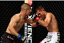 LOS ANGELES, CA - AUGUST 04:  John Moraga strikes Ulysses Gomez prior to knocking him out in the first round during the UFC on FOX event at Staples Center on August 4, 2012 in Los Angeles, California.  (Photo by Josh Hedges/Zuffa LLC via Getty Images)