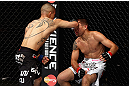 LOS ANGELES, CA - AUGUST 04:  John Moraga strikes Ulysses Gomez prior to knocking him out in the first round during the UFC on FOX event at Staples Center on August 4, 2012 in Los Angeles, California.  (Photo by Josh Hedges/Zuffa LLC via Getty Images)