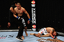 LOS ANGELES, CA - AUGUST 04:  The referee pulls John Moraga off Ulysses Gomez after Moraga knocked Gomez out in the first round during the UFC on FOX event at Staples Center on August 4, 2012 in Los Angeles, California.  (Photo by Josh Hedges/Zuffa LLC via Getty Images)