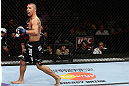 LOS ANGELES, CA - AUGUST 04:  John Moraga celebrates after knocking out Ulysses Gomez in the first round during the UFC on FOX event at Staples Center on August 4, 2012 in Los Angeles, California.  (Photo by Josh Hedges/Zuffa LLC via Getty Images)