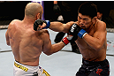 LOS ANGELES, CA - AUGUST 04:  Manny Gamburyan lands a punch on Michihiro Omigawa during their Featherweight bout at the UFC on FOX event at Staples Center on August 4, 2012 in Los Angeles, California. Gamburyan defeated Omigawa by unanimous decision.  (Photo by Josh Hedges/Zuffa LLC via Getty Images)
