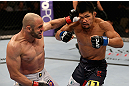 LOS ANGELES, CA - AUGUST 04:  Manny Gamburyan (L) lands a punch on Michihiro Omigawa (R) during their Featherweight bout at the UFC on FOX event at Staples Center on August 4, 2012 in Los Angeles, California. Gamburyan defeated Omigawa by unanimous decision.  (Photo by Josh Hedges/Zuffa LLC via Getty Images)