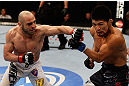 LOS ANGELES, CA - AUGUST 04:  Manny Gamburyan exchanges strikes with Michihiro Omigawa during their Featherweight bout at the UFC on FOX event at Staples Center on August 4, 2012 in Los Angeles, California. Gamburyan defeats Omigawa by unanimous decision.  (Photo by Josh Hedges/Zuffa LLC via Getty Images)