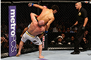 LOS ANGELES, CA - AUGUST 04:  Manny Gamburyan takes down Michihiro Omigawa in their Featherweight bout during UFC on FOX event at Staples Center on August 4, 2012 in Los Angeles, California.  (Photo by Josh Hedges/Zuffa LLC via Getty Images)