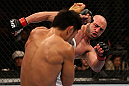 LOS ANGELES, CA - AUGUST 04:  Manny Gamburyan kicks Michihiro Omigawa in their Featherweight bout during UFC on FOX event at Staples Center on August 4, 2012 in Los Angeles, California.  (Photo by Josh Hedges/Zuffa LLC via Getty Images)