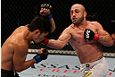 LOS ANGELES, CA - AUGUST 04:  Manny Gamburyan (R) lands a punch on Michihiro Omigawa (L) during their Featherweight bout at the UFC on FOX event at Staples Center on August 4, 2012 in Los Angeles, California. Gamburyan defeated Omigawa by unanimous decision.  (Photo by Josh Hedges/Zuffa LLC via Getty Images)