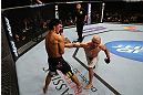 LOS ANGELES, CA - AUGUST 04:  Manny Gamburyan (R) lands a punch on Michihiro Omigawa (L) during their Featherweight bout at the UFC on FOX event at Staples Center on August 4, 2012 in Los Angeles, California. Gamburyan defeated Omigawa by unanimous decision.  (Photo by Josh Hedges/Zuffa LLC via Getty Images)