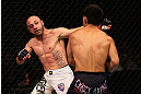 LOS ANGELES, CA - AUGUST 04:  Manny Gamburyan (L) exchanges strikes with Michihiro Omigawa (R) during their Featherweight bout at the UFC on FOX event at Staples Center on August 4, 2012 in Los Angeles, California. Gamburyan defeated Omigawa by unanimous decision.  (Photo by Josh Hedges/Zuffa LLC via Getty Images)