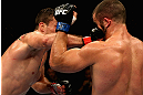LOS ANGELES, CA - AUGUST 04:  Phil De Fries (L) lands a right punch on Oli Thompson (R) during the UFC on FOX at Staples Center on August 4, 2012 in Los Angeles, California.  (Photo by Josh Hedges/Zuffa LLC via Getty Images)