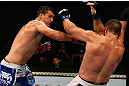 LOS ANGELES, CA - AUGUST 04:  Phil De Fries (L) strikes Oli Thompson (R) during the UFC on FOX at Staples Center on August 4, 2012 in Los Angeles, California.  (Photo by Josh Hedges/Zuffa LLC via Getty Images)
