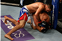 LOS ANGELES, CA - AUGUST 04:  Phil De Fries (top) takes down Oli Thompson during the UFC on FOX at Staples Center on August 4, 2012 in Los Angeles, California. De Fries defeated Thompson by way of a tap out.  (Photo by Josh Hedges/Zuffa LLC via Getty Images)
