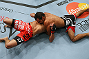 LOS ANGELES, CA - AUGUST 04:  Rani Yahya (R) holds Josh Grispi in a north/south choke prior to Grispi tapping out during the UFC on FOX event at Staples Center on August 4, 2012 in Los Angeles, California.  (Photo by Josh Hedges/Zuffa LLC via Getty Images)
