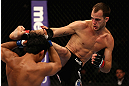 LOS ANGELES, CA - AUGUST 04:  Cole Miller (R)  kicks Nam Phan in their featherweight bout during UFC on FOX at Staples Center on August 4, 2012 in Los Angeles, California.  Phan defeated Miller by split decision.  (Photo by Josh Hedges/Zuffa LLC via Getty Images)