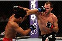 LOS ANGELES, CA - AUGUST 04:  Nam Phan (L) lands a punch on Cole Miller in their featherweight bout during UFC on FOX at Staples Center on August 4, 2012 in Los Angeles, California.  (Photo by Josh Hedges/Zuffa LLC via Getty Images)