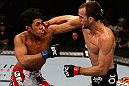 LOS ANGELES, CA - AUGUST 04:  Cole Miller (R) lands a punch on Nam Phan (L) in their featherweight bout during UFC on FOX at Staples Center on August 4, 2012 in Los Angeles, California.  Phan defeated Miller by split decision.  (Photo by Josh Hedges/Zuffa LLC via Getty Images)