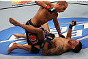 LOS ANGELES, CA - AUGUST 04:  Mike Swick takes down Damarques Johnson in the second round of their welterweight bout during UFC on FOX at Staples Center on August 4, 2012 in Los Angeles, California.  Swick won the bout by way of TKO in the second round.  (Photo by Josh Hedges/Zuffa LLC via Getty Images)