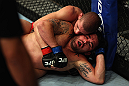 LOS ANGELES, CA - AUGUST 04:  Joe Lauzon (top) takes down Jamie Varner in their lightweight bout during the UFC on FOX at Staples Center on August 4, 2012 in Los Angeles, California. Lauzon won by way of submission by triangle choke.  (Photo by Josh Hedges/Zuffa LLC via Getty Images)