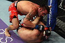 LOS ANGELES, CA - AUGUST 04:  Jamie Varner takes down Joe Lauzon in their lightweight bout during the UFC on FOX at Staples Center on August 4, 2012 in Los Angeles, California. Lauzon won by way of submission by triangle choke.  (Photo by Josh Hedges/Zuffa LLC via Getty Images)