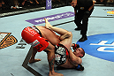 LOS ANGELES, CA - AUGUST 04:  Joe Lauzon secured submission by Jamie Varnerin the triangle choke in the third round during the UFC on FOX at Staples Center on August 4, 2012 in Los Angeles, California.  (Photo by Josh Hedges/Zuffa LLC via Getty Images)