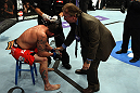 LOS ANGELES, CA - AUGUST 04:  Jamie Varner is checked out after being defeated by Joe Lauzon in their lightweight bout during the UFC on FOX at Staples Center on August 4, 2012 in Los Angeles, California. Lauzon won by way of submission by triangle choke.  (Photo by Josh Hedges/Zuffa LLC via Getty Images)