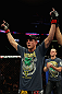 LOS ANGELES, CA - AUGUST 04:  Joe Lauzon celebrates after defeating Jamie Varner in their lightweight bout during the UFC on FOX at Staples Center on August 4, 2012 in Los Angeles, California. Lauzon won by way of submission by triangle choke. (Photo by Josh Hedges/Zuffa LLC via Getty Images)