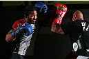 DENVER, CO - AUGUST 08:  Benson Henderson works out for the media during the UFC 150 open workouts at the Muscle Pharm Sports Science Center on August 8, 2012 in Denver, Colorado. (Photo by Josh Hedges/Zuffa LLC/Zuffa LLC via Getty Images)